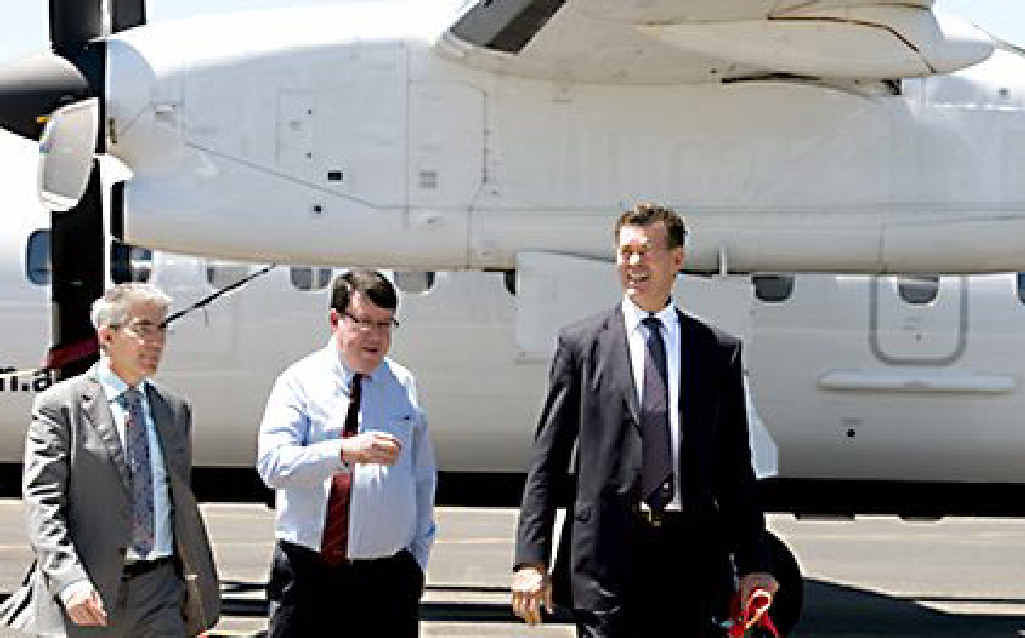 Skytrans touches down with (from left) the company’s managing director Simon Wild, Deputy Premier Paul Lucas and Mayor Peter Taylor aboard.